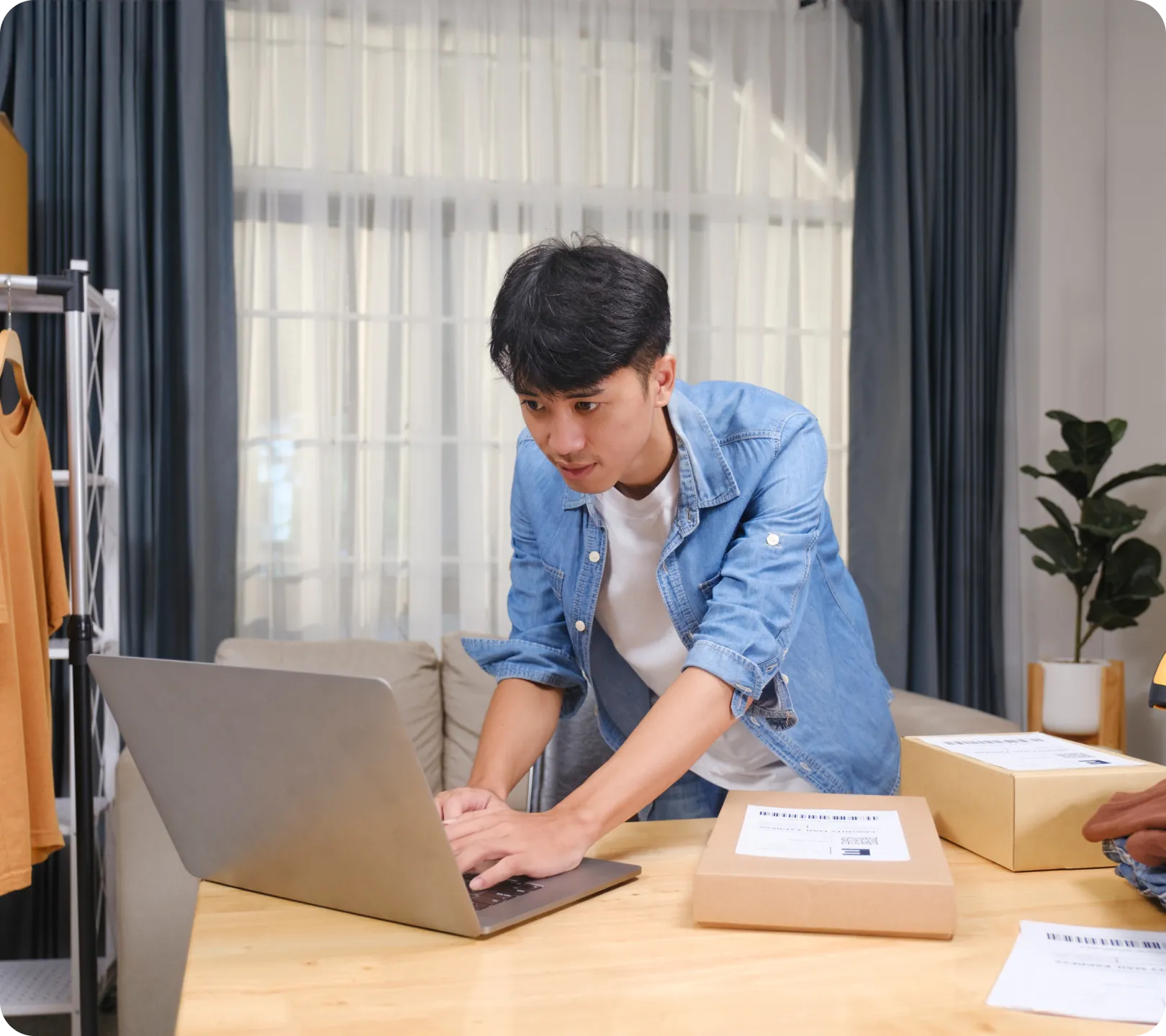 young-entrepreneur-managing-online-clothing-business young-entrepreneur-managing-online-clothing-business